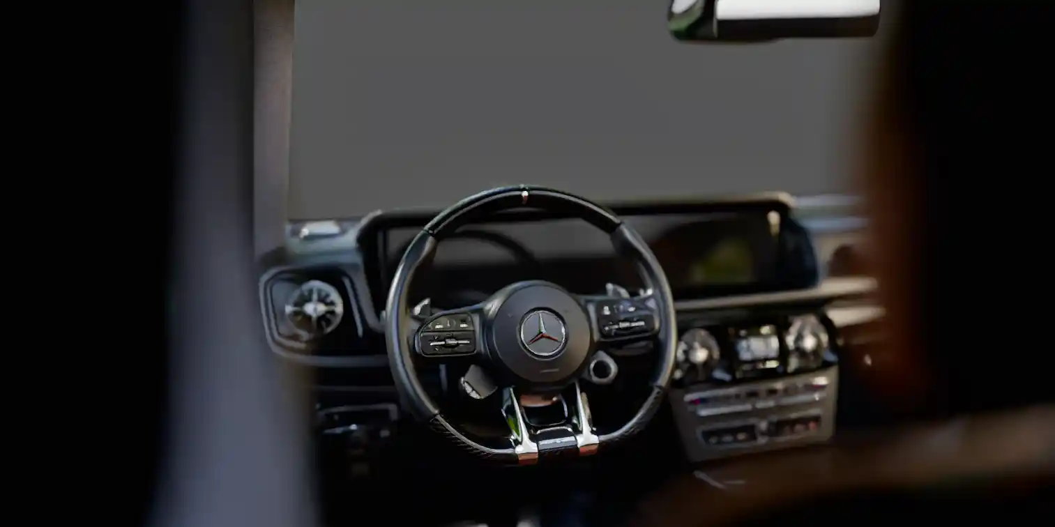 Mercedes G-Class cockpit — steering wheel, dashboard trim and centre console